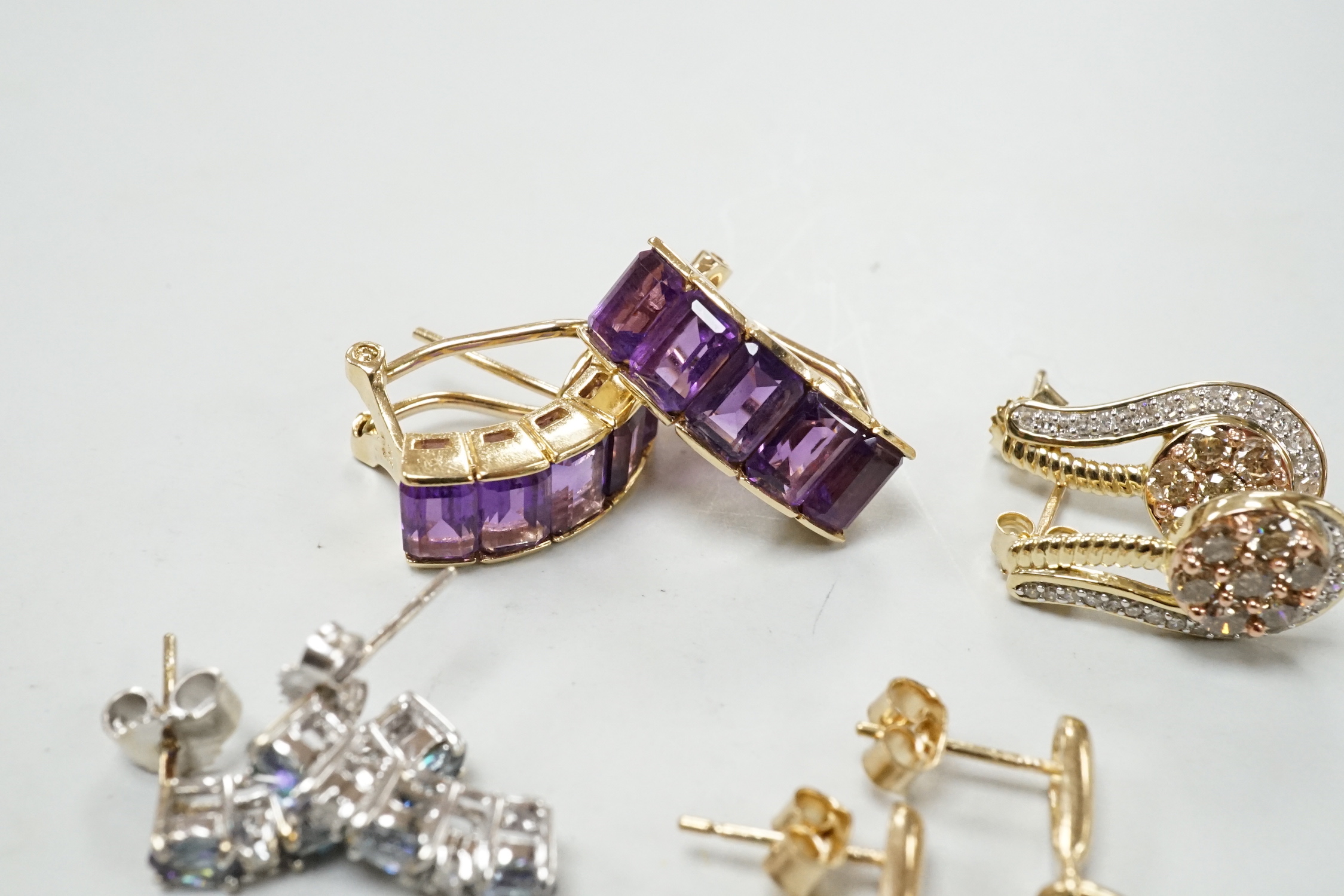 A modern pair of 585 yellow metal and five stone amethyst set demi lune earrings, 18mm, gross weight 6.2 grams, together with three modern pairs of 9ct and gem set earrings including two colour diamond cluster and one ot